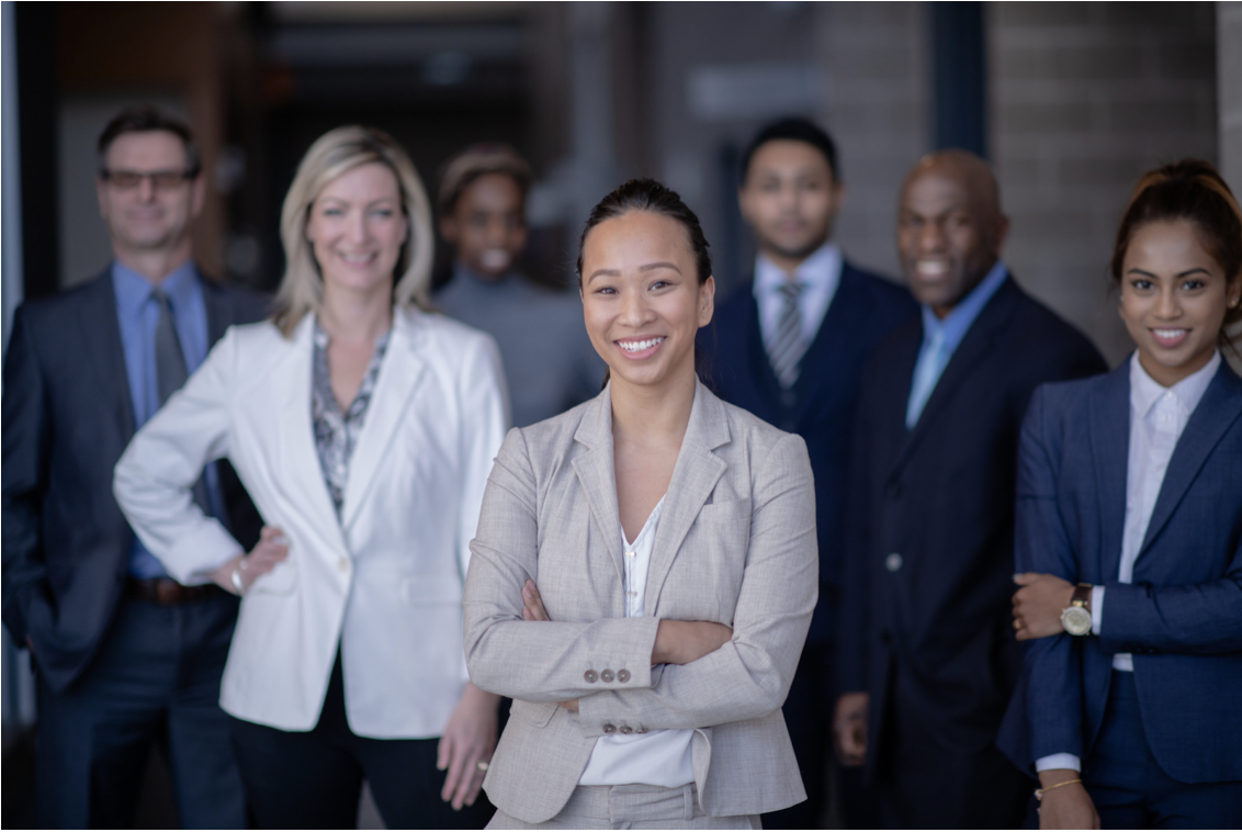 Smiling professionally-dressed adults