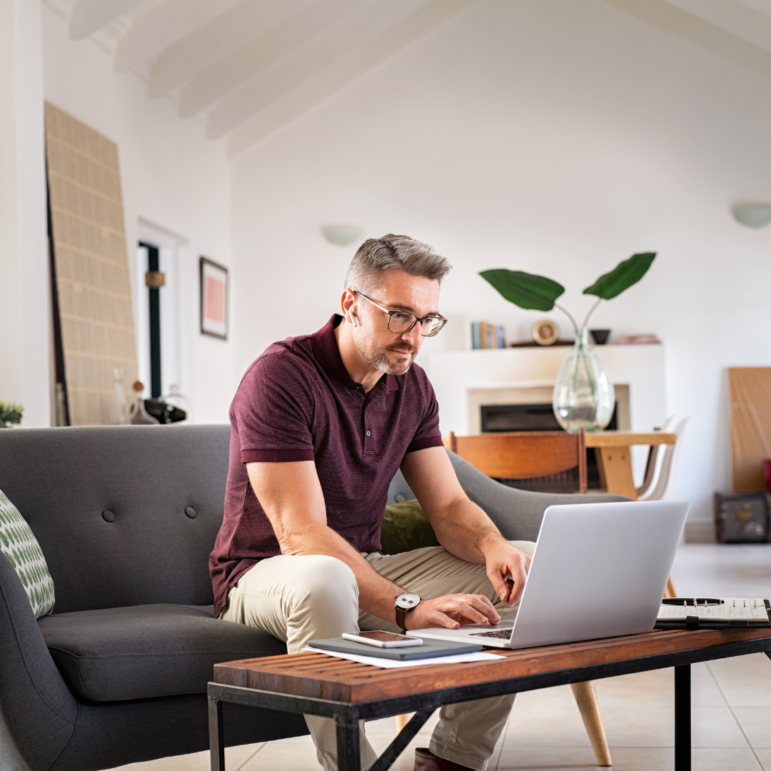 Man looking intently at laptop screen